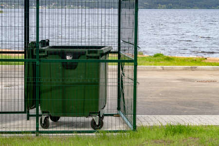 container for garbage collection on the shore of the lakeの写真素材
