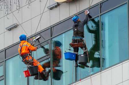 Petrozavodsk, Russia - 29 May 2021. window cleaner on a high-rise building