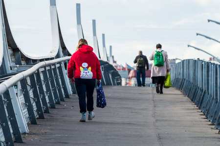 people walk along the pedestrian part of the road interchangeのeditorial素材