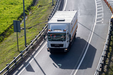 a small truck driving on the highwayのeditorial素材