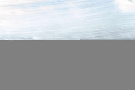 abstract background with a stream of water and a stone shore.の写真素材