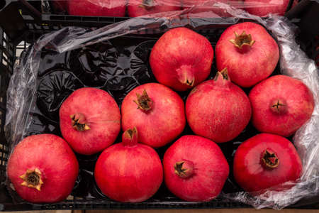 ripe pomegranate in a box. High quality photoの写真素材