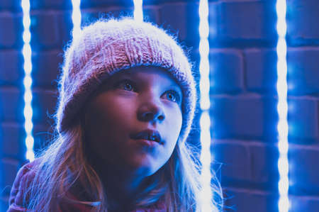 night portrait of an eight-year-old girl. High quality photoの写真素材