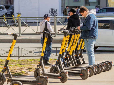 a man rents an electric scooter