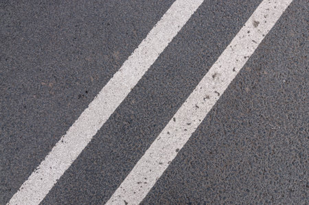 Asphalt texture with a double solid line prohibiting overtakingの写真素材