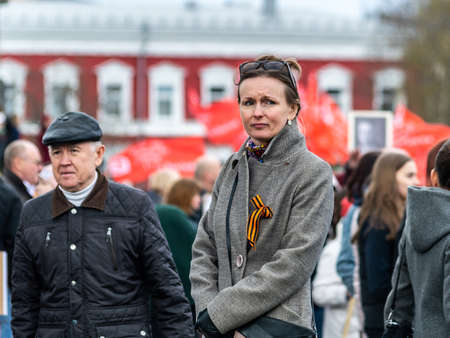 Petrozavodsk, Russia - 9 May 2022. portrait of a sad woman during the celebration of Victory Day. selective focusのeditorial素材