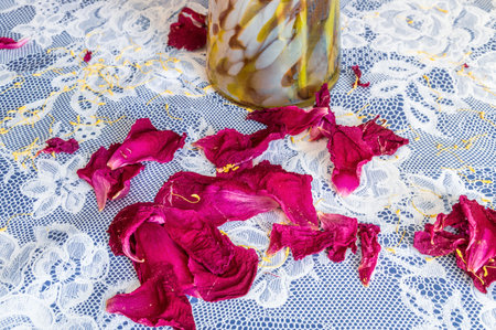 scattered petals on the tableの写真素材