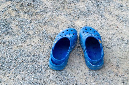blue children's shoes made of EVA on the groundの写真素材