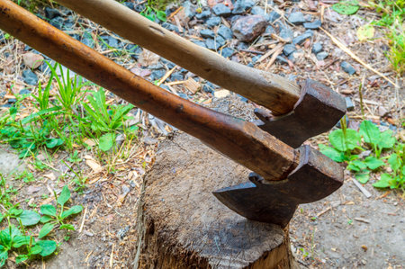two axes in block for chopping firewood close upの写真素材