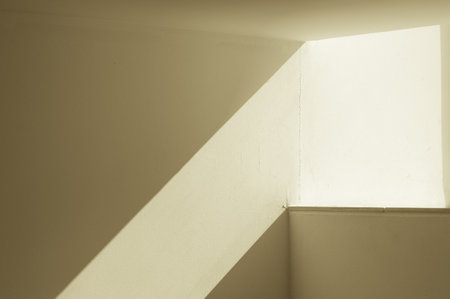 abstract background with a narrow strip of sunlight on the wall