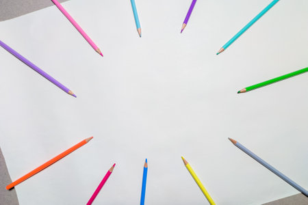 Multicolored pencils on a piece of paper. Pencil frameの写真素材