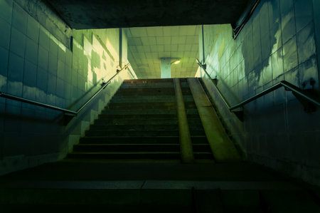 Dark staircase leading to lightの写真素材