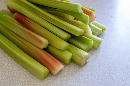 Rhubarb stalks stacked on the tableの写真素材