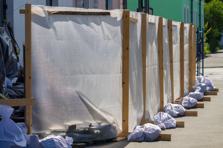 Fencing around the renovated facade of the buildingの写真素材