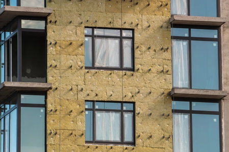 insulation of walls of apartment building under constructionの写真素材