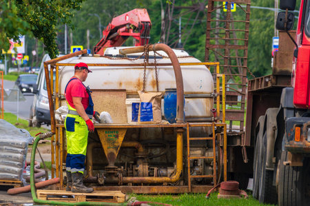 Petrozavodsk, Russia - 18 July 2023. The person preparing the drilling mudのeditorial素材