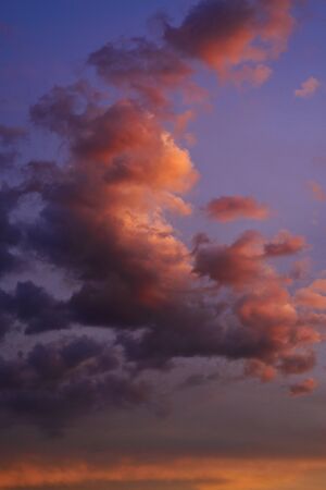Fairy clouds in the sky with beautiful different colors at sunset