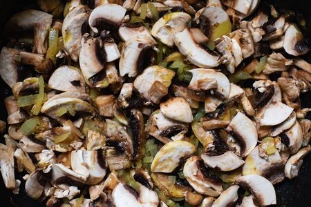 Sliced mushrooms roast with onion in panの写真素材