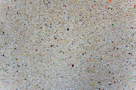 Plaster of marble chips and multi-colored glass shards. texture of decorative plaster based on small colored marble stones and glass, close-up abstract background.の写真素材