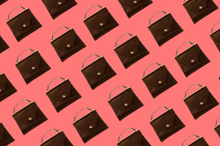 Colorful handbag pattern on pink background, flat lay, top view. Design for packaging. Shopping concept.の写真素材