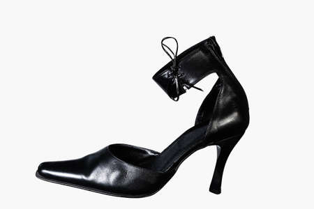 Elegant expensive black female high-heeled shoes on a white background. Elegant women's shoesの写真素材