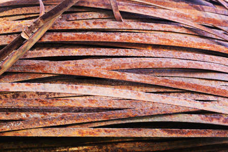 Rolled metal glass. Steel stripes of a flat section, background photo rusty textureの写真素材