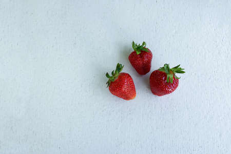white wooden table and fruits on itの写真素材