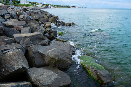 Sea boulders beach waves crashing. Sea waves crashing at bouldersの写真素材