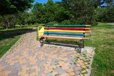 Landscape with an original bench in the parkの写真素材