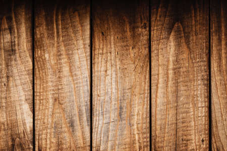 Weathered wood planks boarding with darkened edges for background or texture.