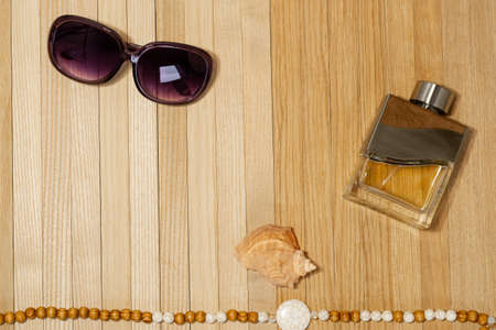 Womens casual accessories on a wooden plank surface