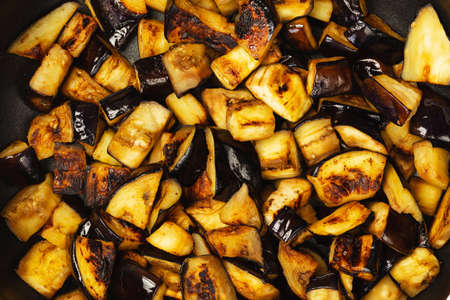 Cooked fried eggplant slices in a frying panの写真素材