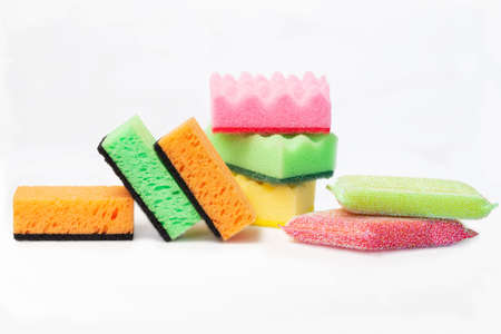 Different kitchen sponges and washcloths for dishes and care of kitchen utensils on a white...