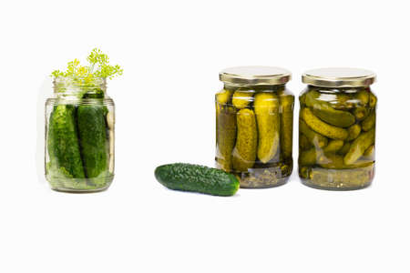 Pickled cucumbers canned for future use in glass jars and only prepared cucumbers for canningの写真素材