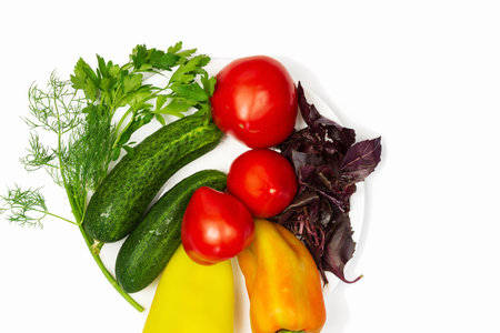 Fresh vegetables and spicy herbs with top view on white background .Traditional vegetarian food.の写真素材
