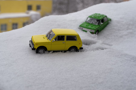Cars drive in winter in deep snow in the coldの写真素材