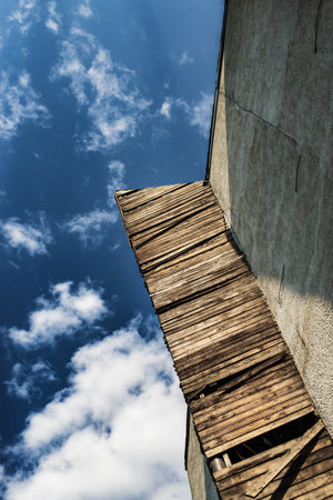 An old industrial building with a concrete facade and ruined decor. architecture and construction...