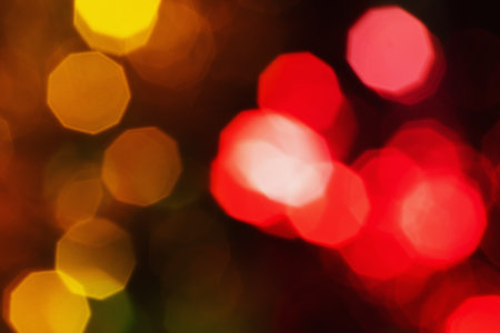 Red and orange holiday bokeh. Abstract christmas backgroundの写真素材