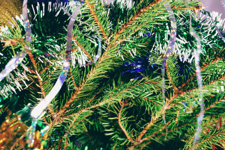 Decorated Christmas tree on blurred, sparkling and fairy backgroundの写真素材