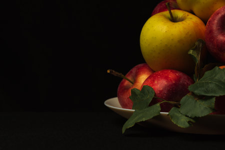 Freshly picked apples on a plate for background