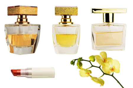 Different shapes of glass bottles of women's perfumes and lipstickの写真素材