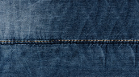 Blue denim texture background .Denim with horizontal seam and stitchingの写真素材