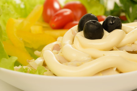 Vitamin vegetable salad with pieces of tunaの写真素材