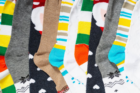Multi-colored colorful with patterns and stripes children's socks close-up burnt closeの写真素材