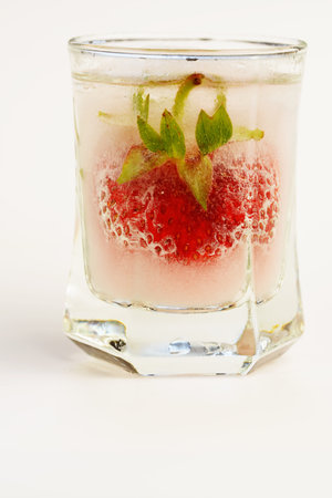 Fruity red berry in ice in a glassの写真素材