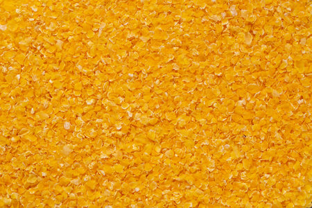 Background with texture of yellow tasty and healthy cereals.