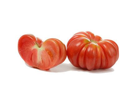 Tomato isolated. Tomatoes on white background. Fruit of varietal sweet tomato and half of fruit side view. With clipping path.の写真素材