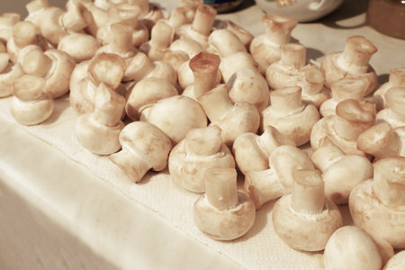 Cooking with white champignons in the kitchen.の写真素材