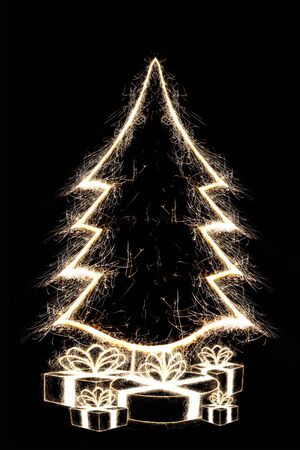 Cristmas tree with presents by sparkler style on black backgroundの写真素材
