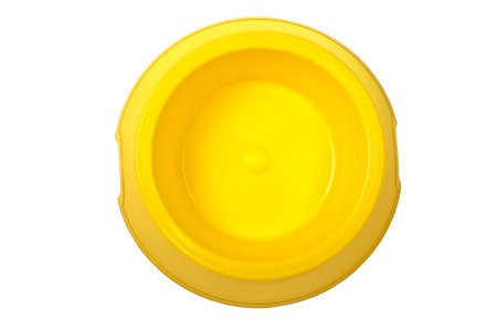Empty yellow bowl isolated on white backgroundの写真素材